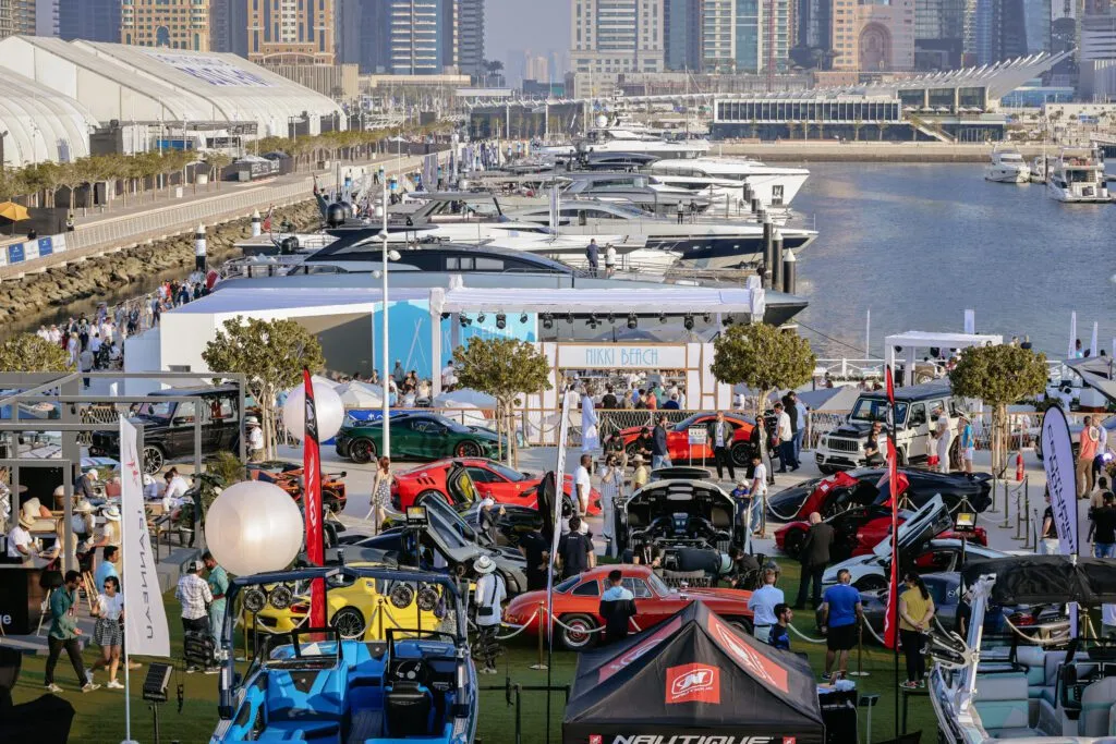 Crowds of visitors exploring luxury yachts at the Dubai International Boat Show