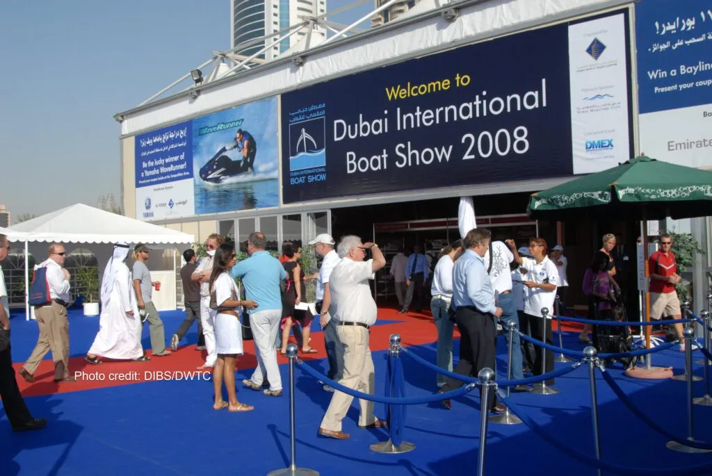 Visitors admiring a luxury yacht on display at the Dubai International Boat Show