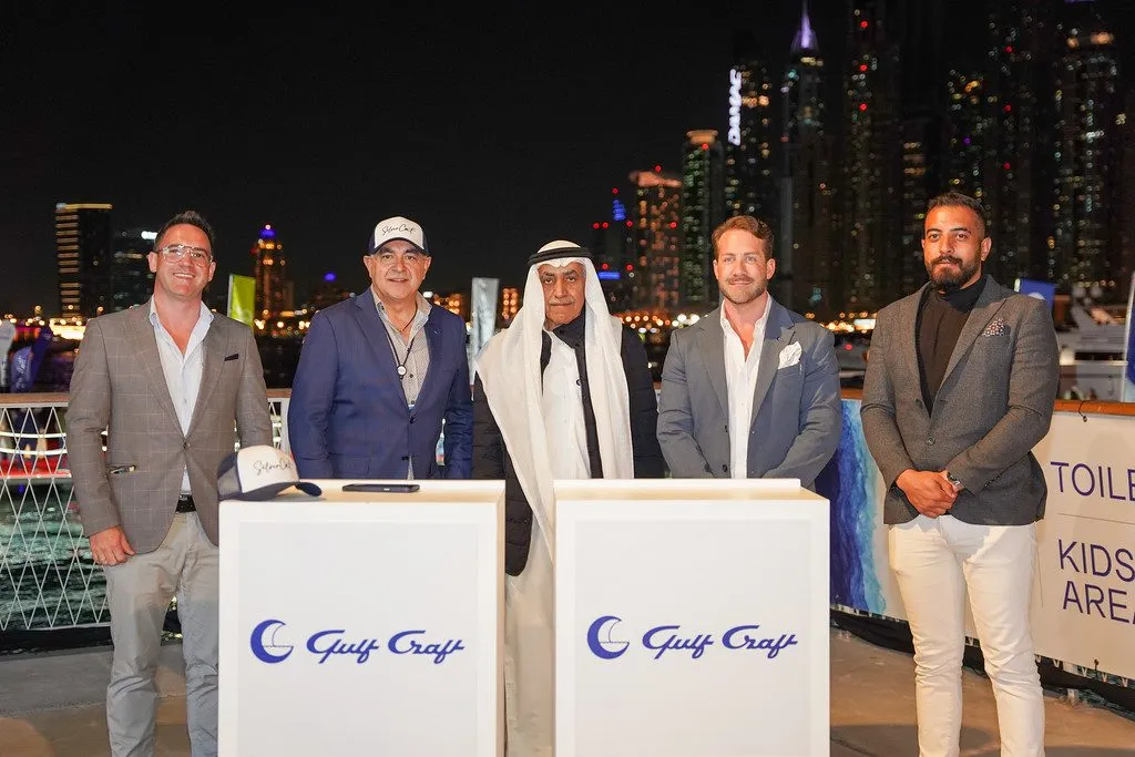 Gulf Craft executives and dignitaries posing for a photo at an event.
